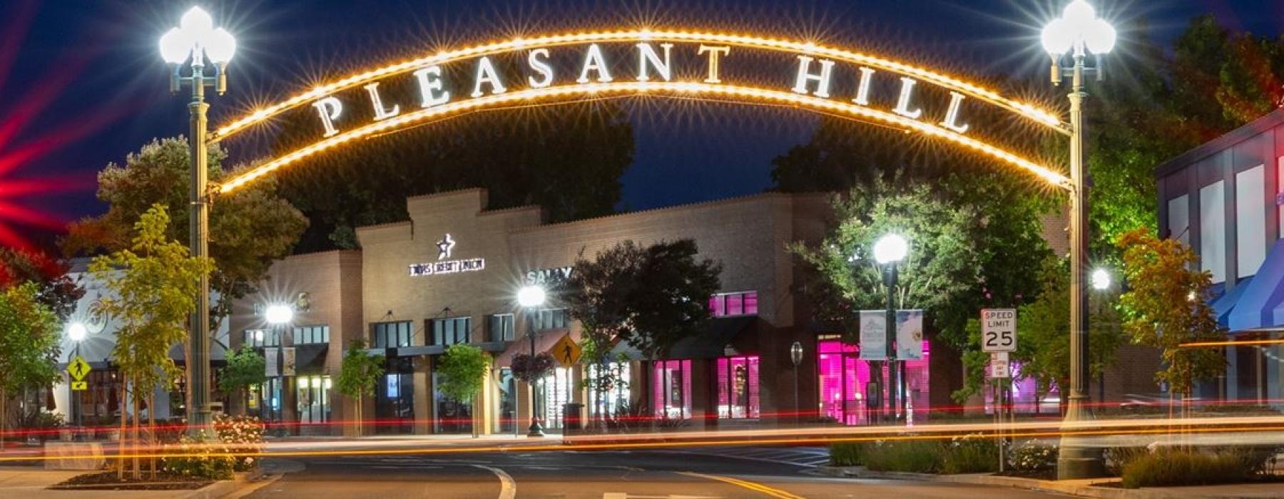 a street with buildings and lights