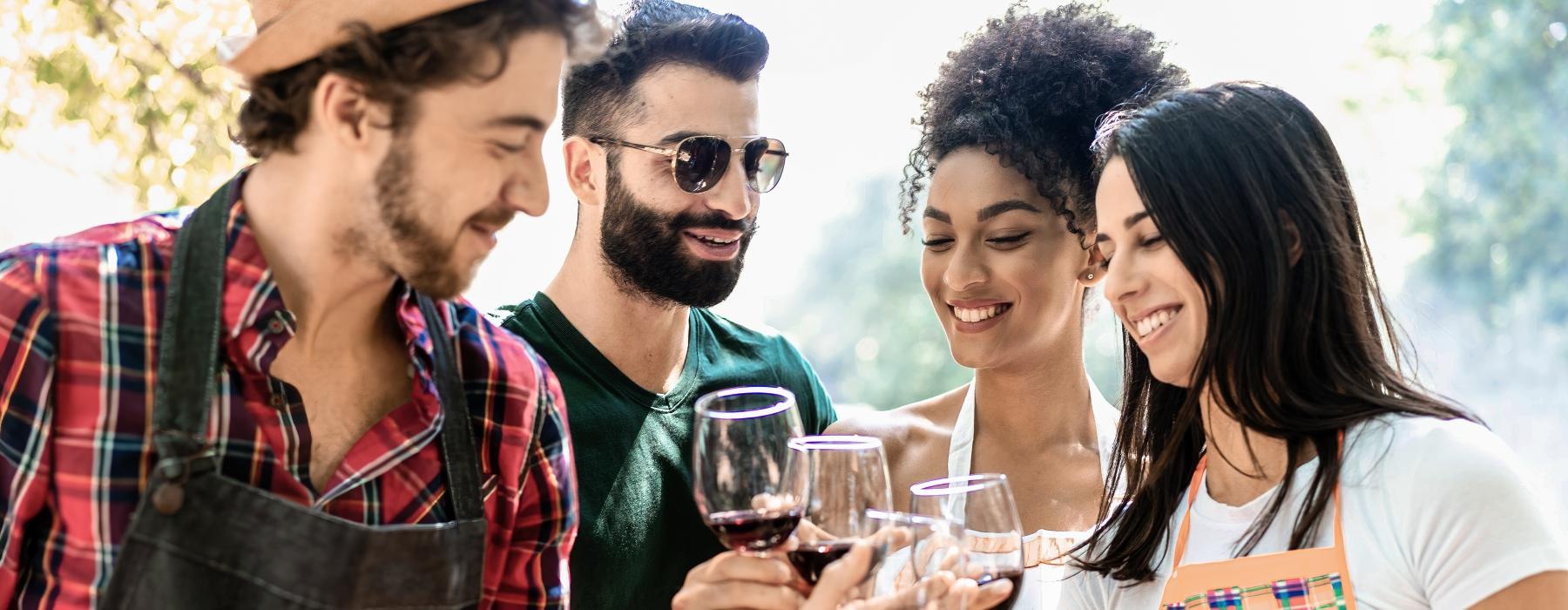 a group of people holding wine glasses
