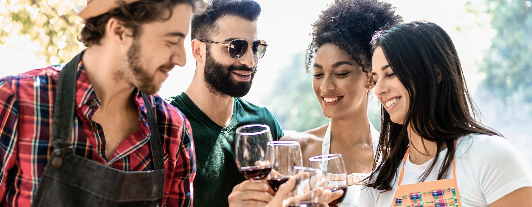 a group of people holding wine glasses